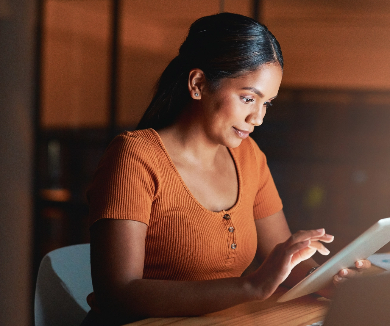 A lady viewing content on her tablet.