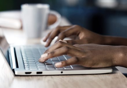 A person using their laptop.